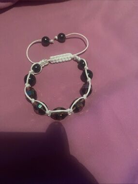 Hand-Knotted White Cord Bracelet with Dark Iridescent Beads